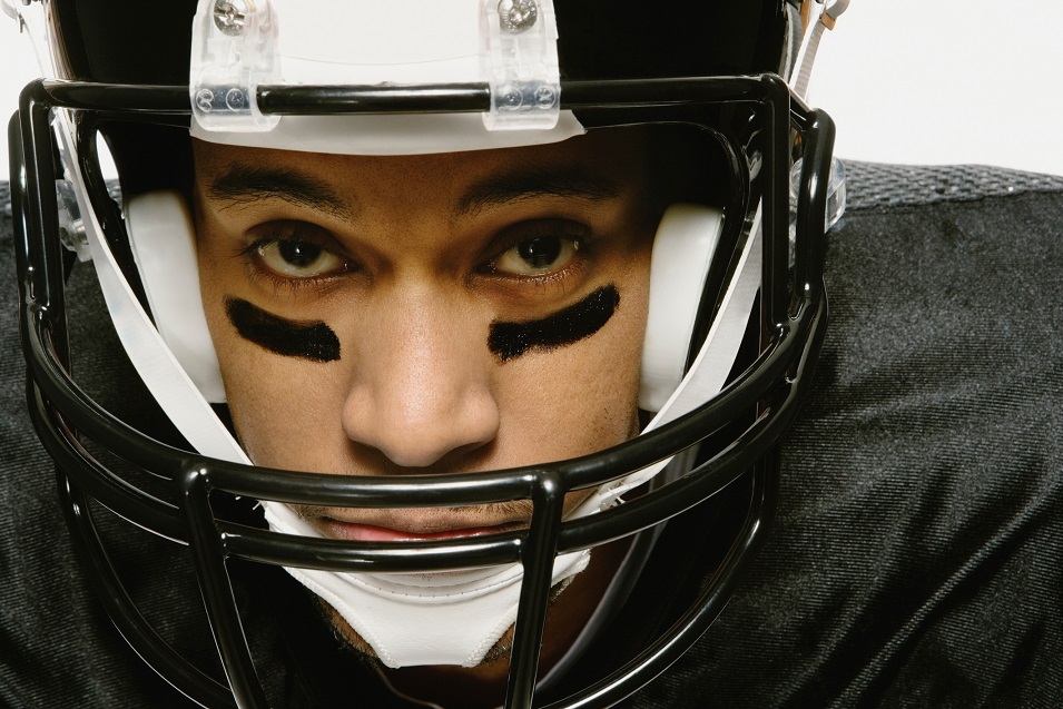 Man wearing a football helmet Man wearing a football helmet.